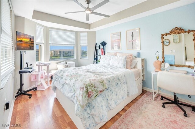 bedroom featuring light hardwood / wood-style floors and ceiling fan