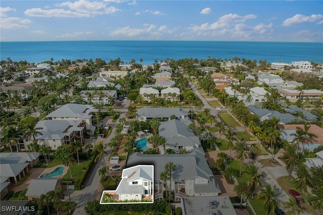 drone / aerial view with a water view