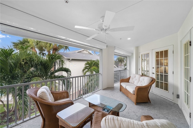 sunroom with ceiling fan and french doors