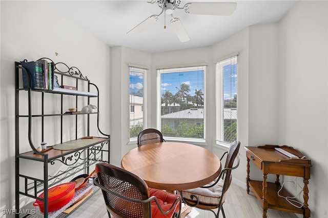 dining space with ceiling fan