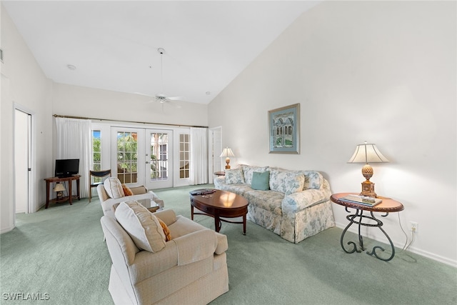 living room with carpet flooring, ceiling fan, high vaulted ceiling, and french doors