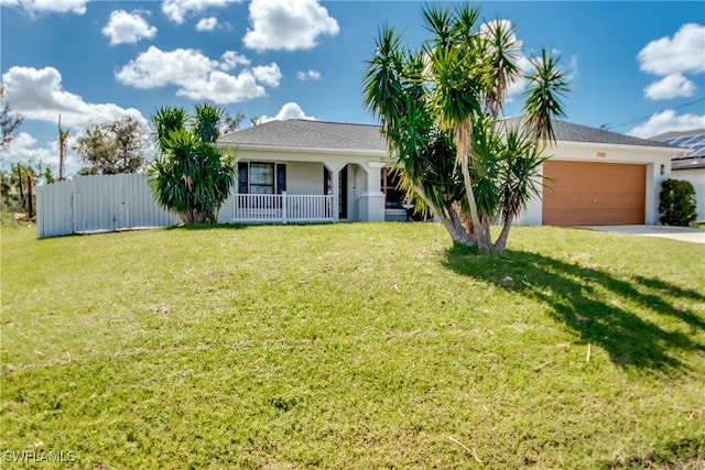 single story home with covered porch, a garage, and a front lawn