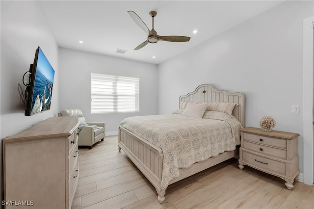 bedroom with ceiling fan and light hardwood / wood-style floors