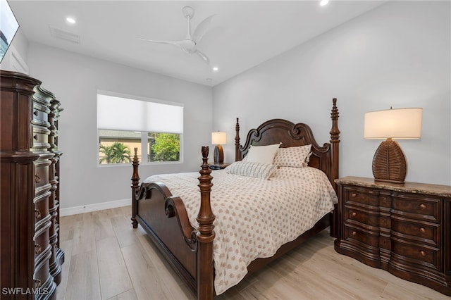 bedroom with light hardwood / wood-style floors and ceiling fan