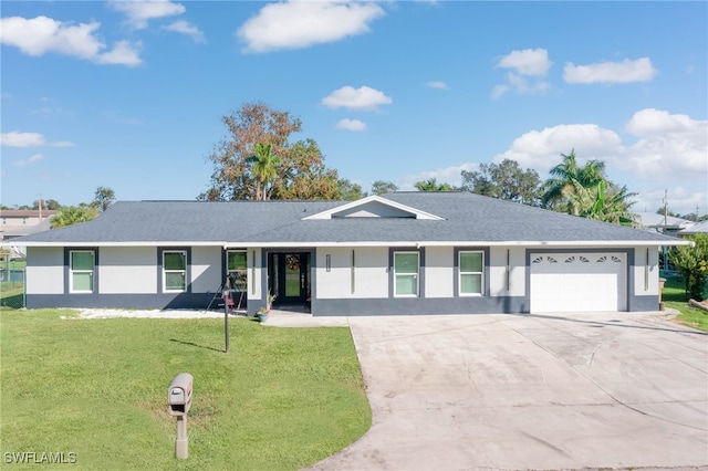 single story home featuring a front yard and a garage