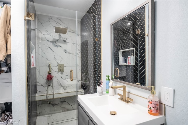 bathroom featuring vanity and a shower with door