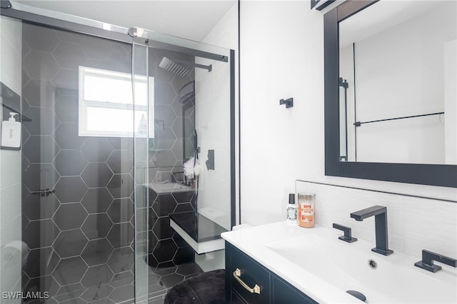 bathroom with vanity and an enclosed shower