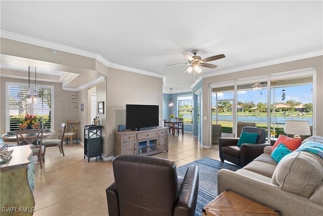 living room featuring ornamental molding, ceiling fan with notable chandelier, and light tile patterned floors