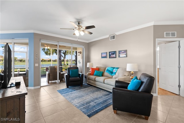 living room featuring crown molding, ceiling fan, light tile patterned floors, and a wealth of natural light