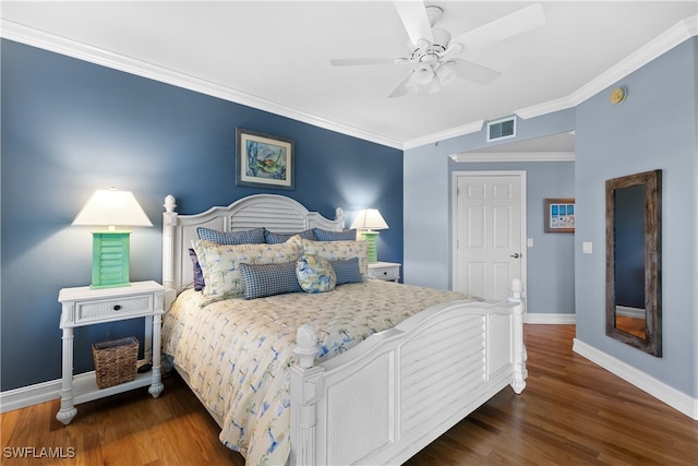 bedroom featuring ceiling fan, ornamental molding, and dark hardwood / wood-style floors