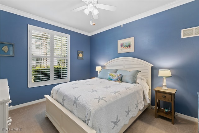 carpeted bedroom featuring ornamental molding and ceiling fan