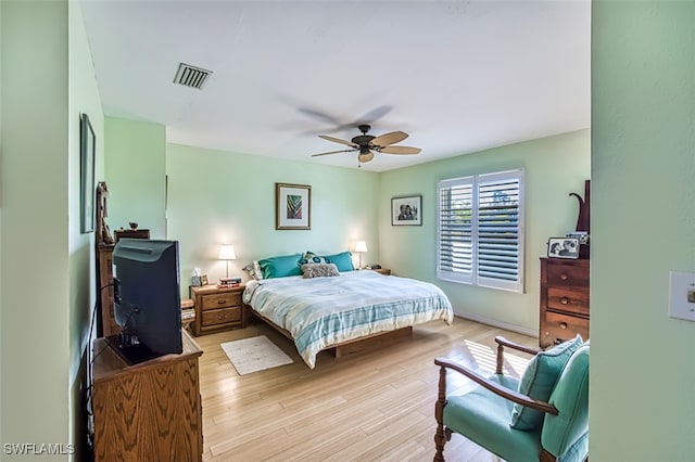 bedroom featuring light wood-type flooring and ceiling fan