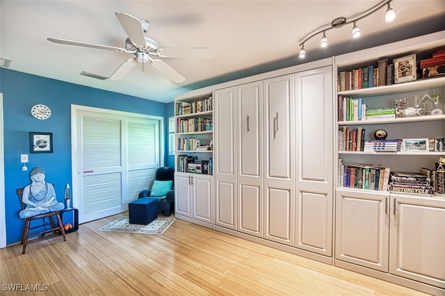 interior space with ceiling fan and light hardwood / wood-style flooring