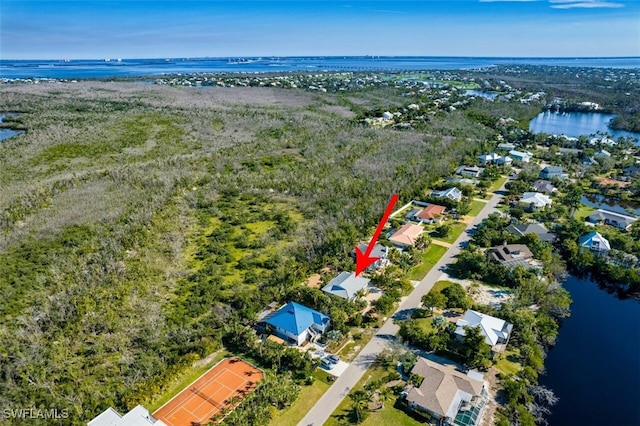 birds eye view of property featuring a water view