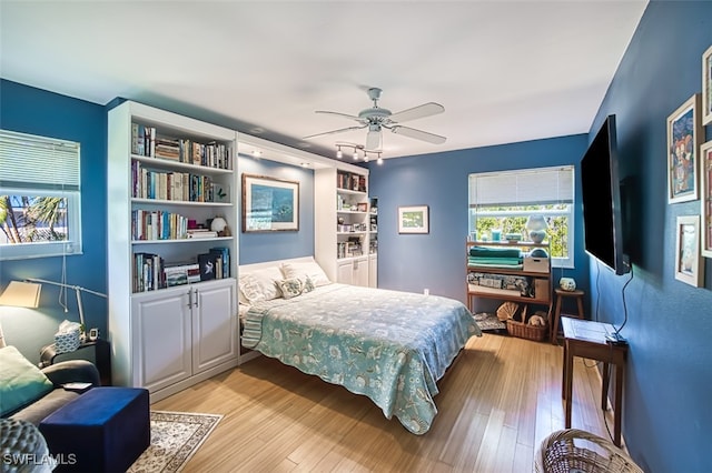 bedroom featuring light hardwood / wood-style floors and ceiling fan