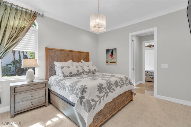 bedroom featuring ornamental molding, a notable chandelier, and light wood-type flooring