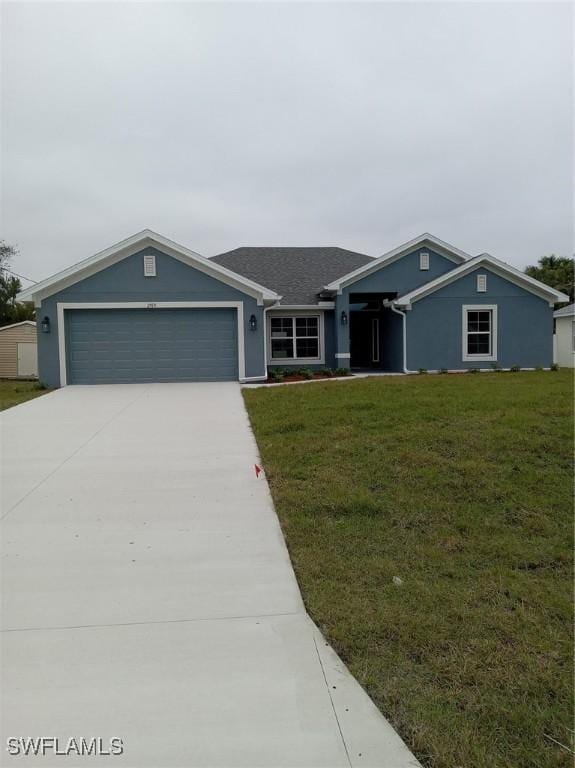 ranch-style home featuring a garage and a front yard