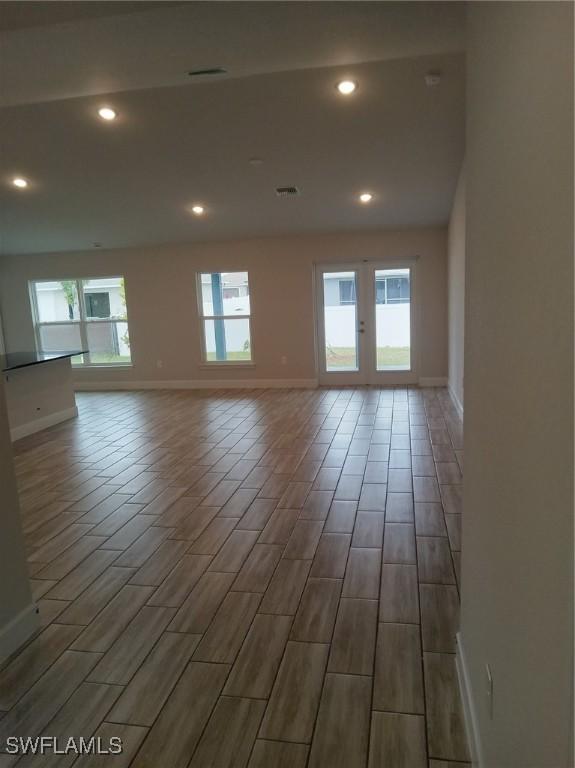 spare room featuring a wealth of natural light