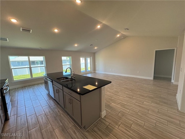 2919 NW 10th St, Cape Coral, FL 33993 - kitchen featuring a sink, dark countertops, wood finish floors, baseboards, and lofted ceiling