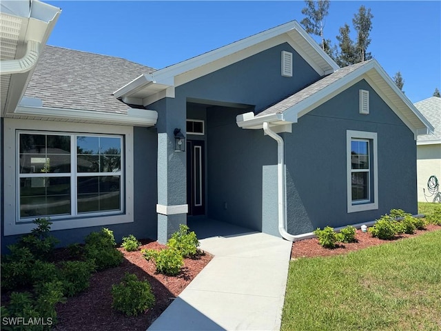 2919 NW 10th St, Cape Coral, FL 33993 - view of front of home featuring roof with shingles and stucco siding
