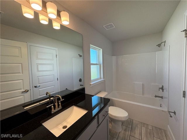 2919 NW 10th St, Cape Coral, FL 33993 - bathroom with toilet,  shower combination, vanity, and wood finished floors