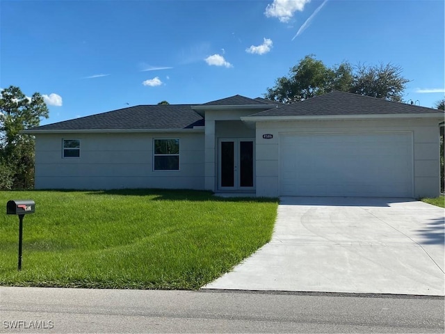 ranch-style house with a garage and a front lawn