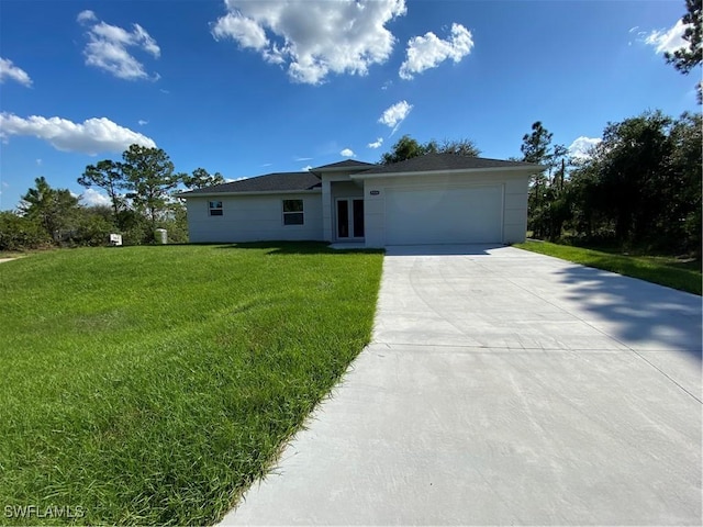 ranch-style house featuring a garage and a front yard