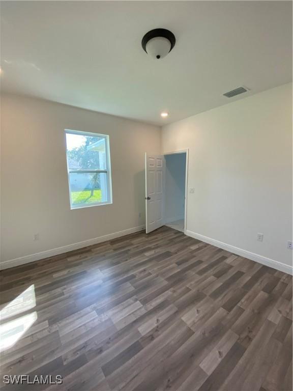 interior space with dark hardwood / wood-style flooring