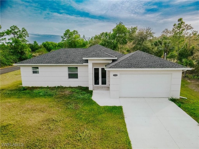 single story home with a garage and a front lawn