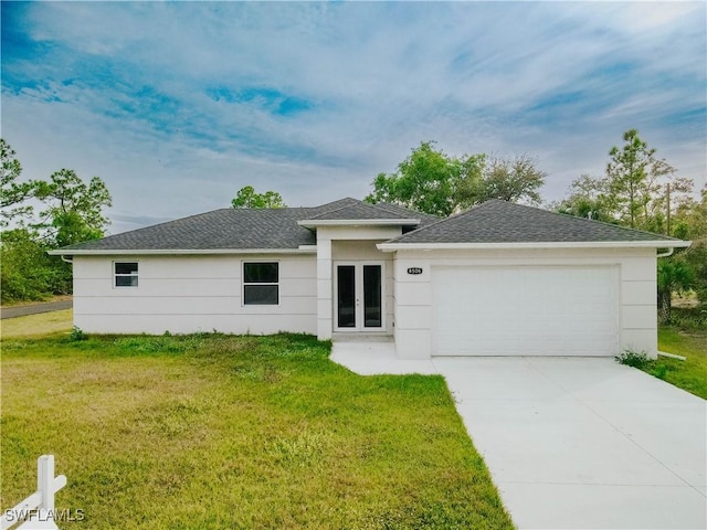 view of front facade with a garage and a front yard