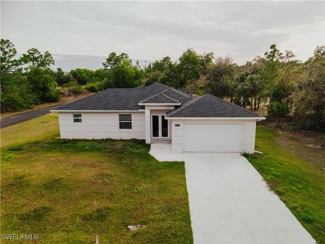 single story home with a garage and a front lawn