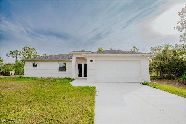 ranch-style home with a garage and a front yard