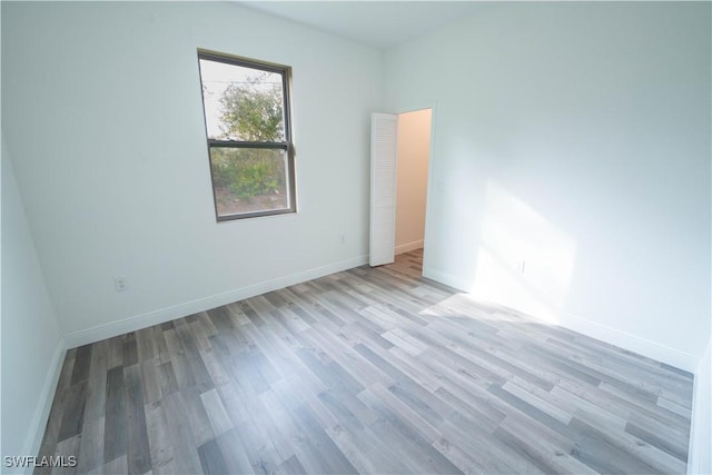 unfurnished room featuring light hardwood / wood-style flooring