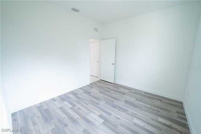 unfurnished room with light hardwood / wood-style flooring