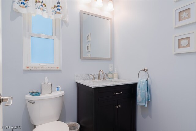 bathroom with vanity and toilet