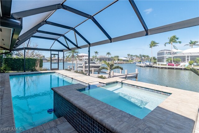 view of pool with an in ground hot tub, a boat dock, a water view, and a lanai