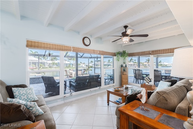 tiled living room with a water view, ceiling fan, beamed ceiling, and wood ceiling