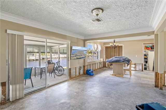 interior space with crown molding, a textured ceiling, and concrete floors