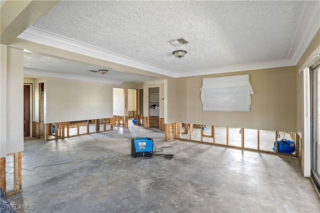 unfurnished room with concrete floors, crown molding, and a textured ceiling