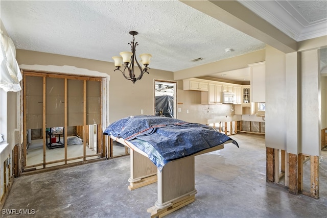 game room featuring crown molding, a textured ceiling, and an inviting chandelier