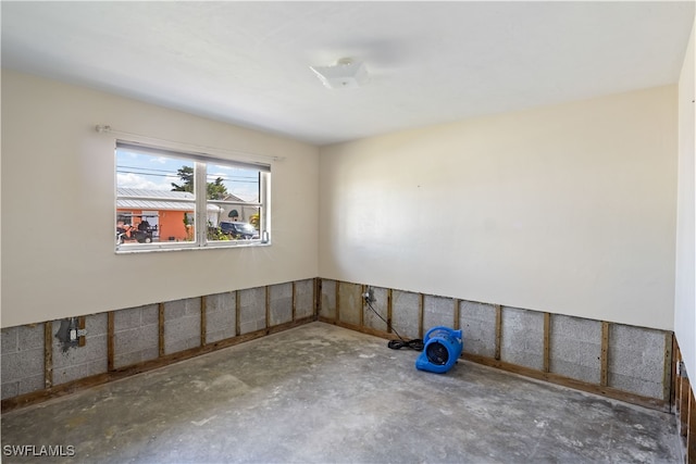 spare room with concrete flooring