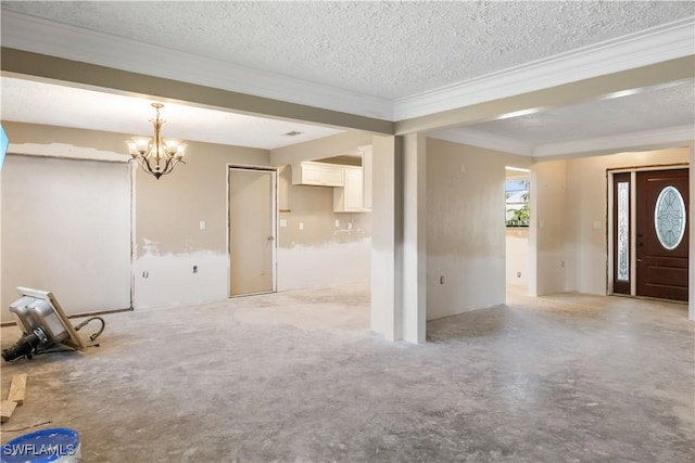 interior space featuring an inviting chandelier, crown molding, and a textured ceiling