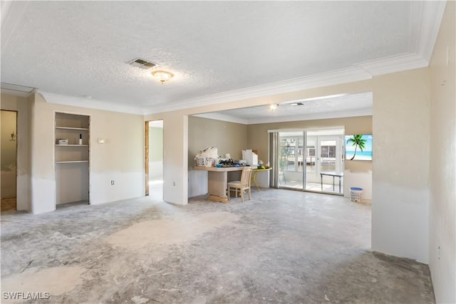 unfurnished living room featuring french doors, ornamental molding, a textured ceiling, and concrete floors