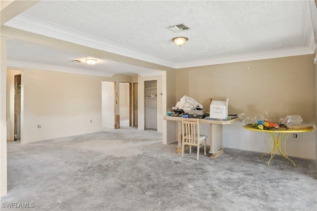 unfurnished room with ornamental molding, carpet flooring, and a textured ceiling