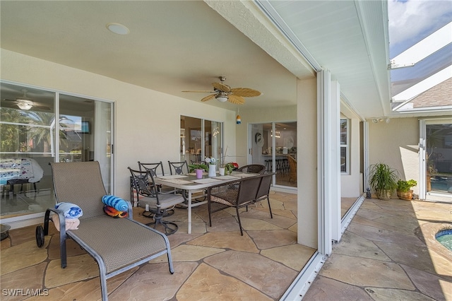 view of patio / terrace featuring ceiling fan