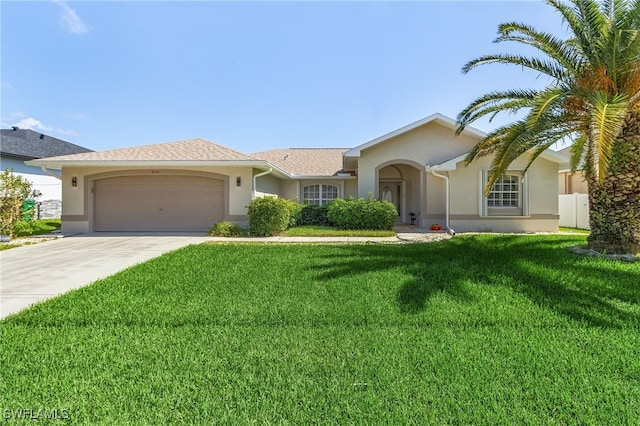 ranch-style home featuring a front lawn and a garage