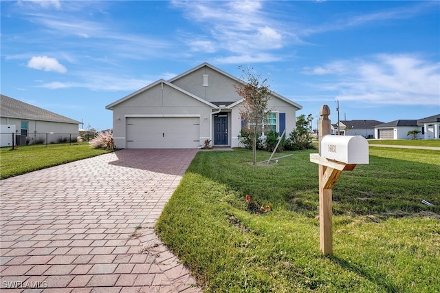 ranch-style home featuring a front yard and a garage