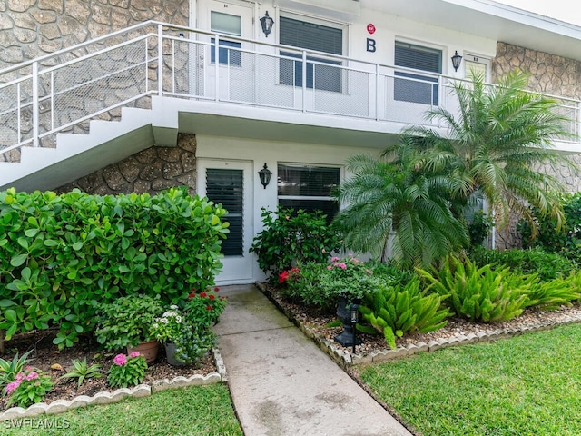 property entrance with a balcony