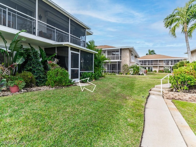 view of yard featuring a sunroom