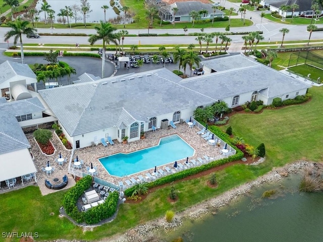 birds eye view of property with a water view